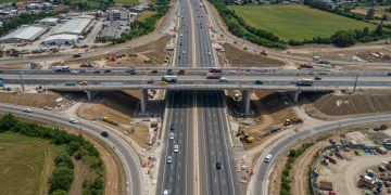 Modern highway interchange under construction, symbolizing federal infrastructure investment.